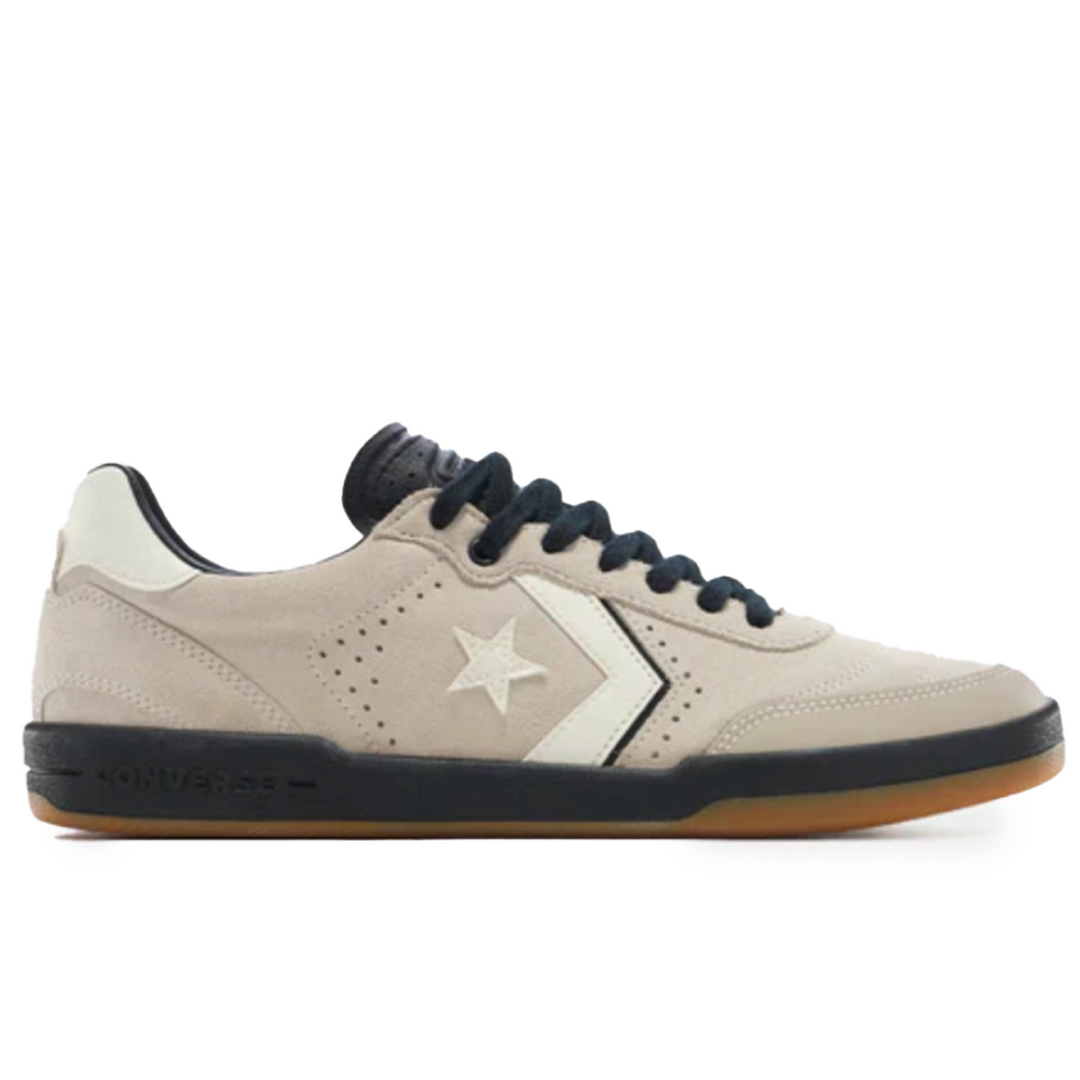 Beige sneaker with black accents on a white background