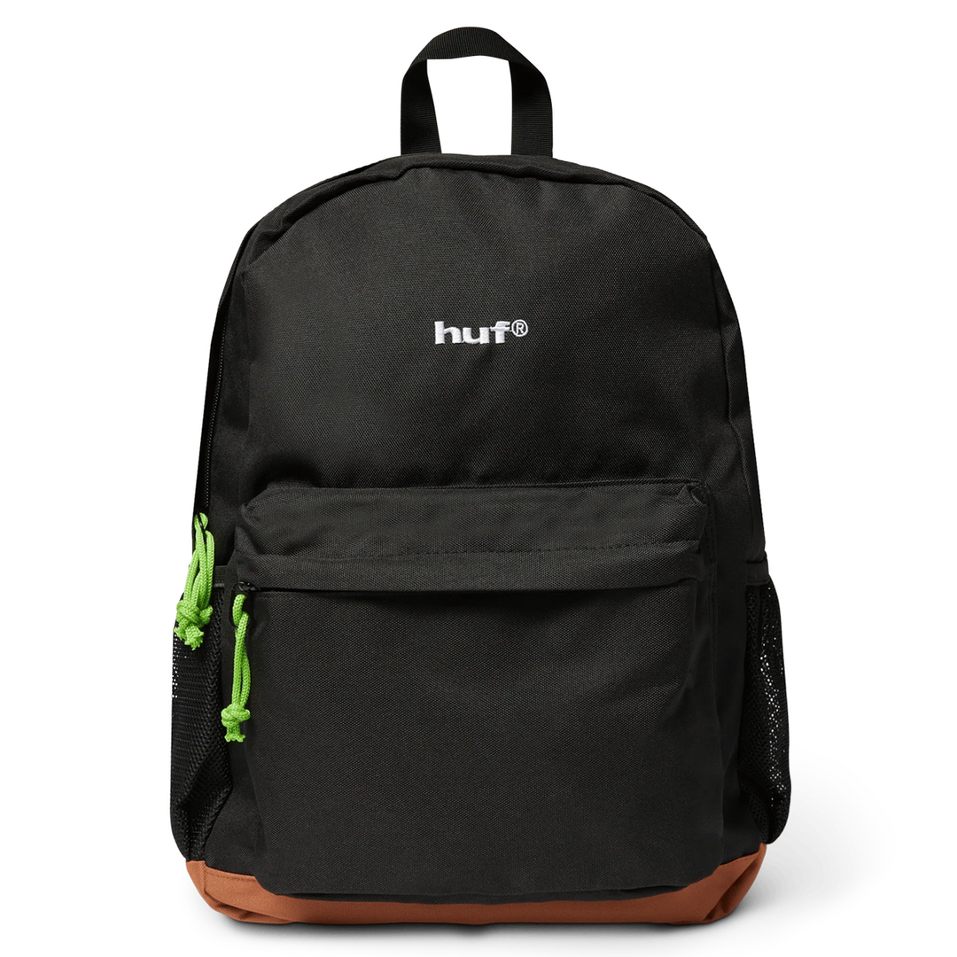 Black backpack with green zipper pulls and brown bottom on a white background
