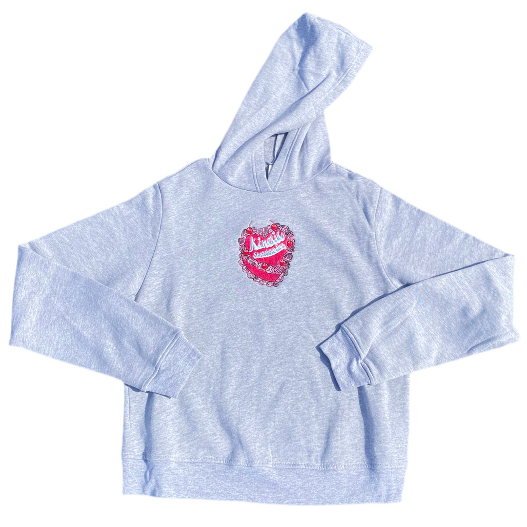 Light blue hoodie with a red heart design on a white background