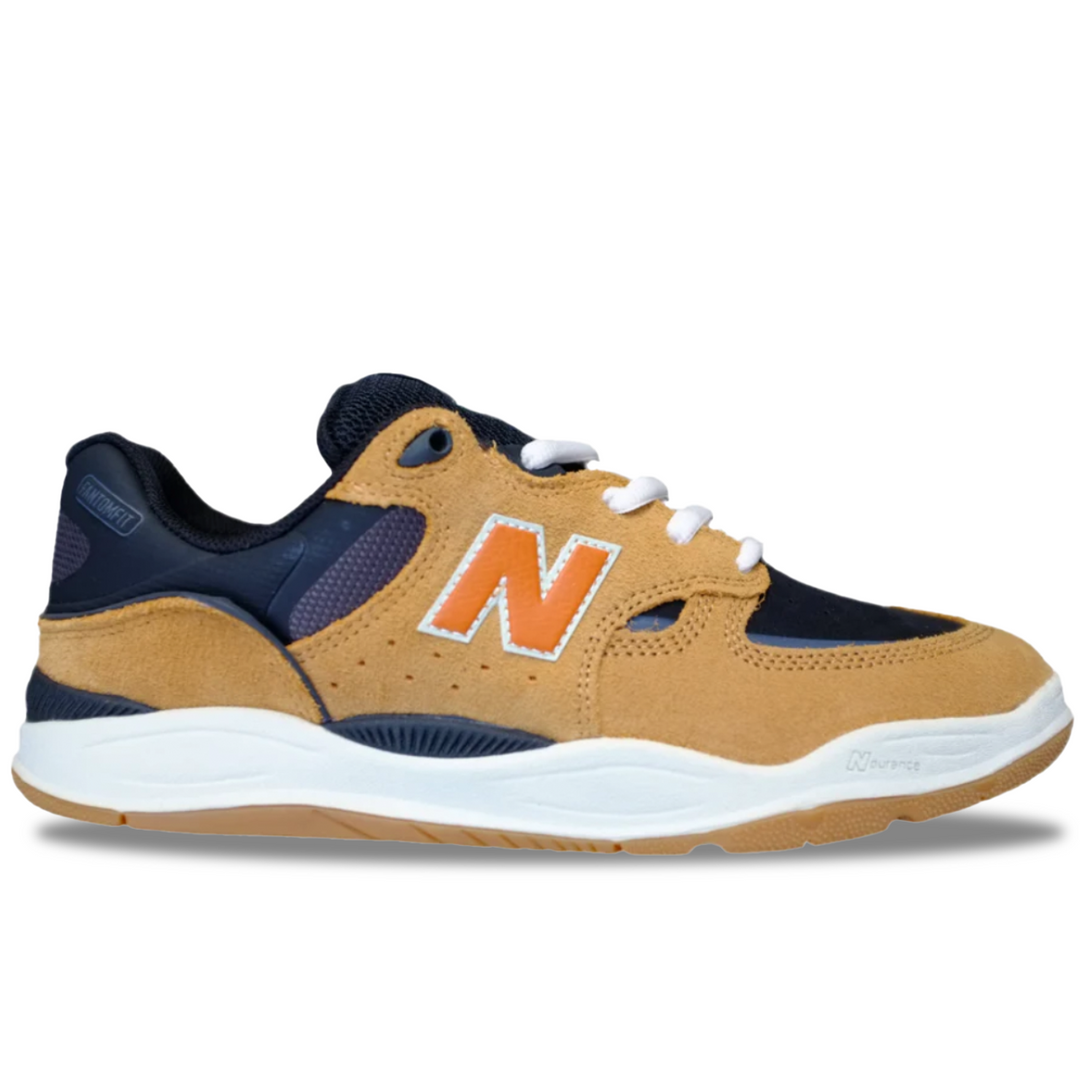Tan and navy sneaker with orange 'N' logo on a white background