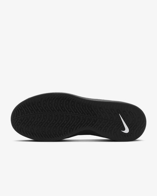 Black Nike shoe sole on a white background