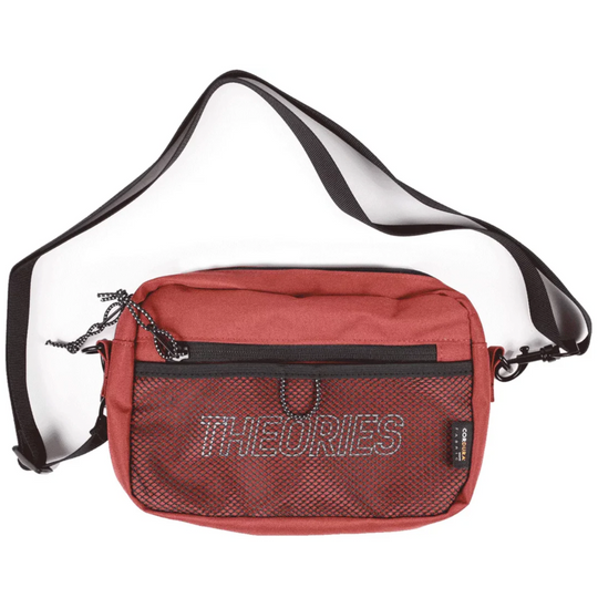 Red shoulder bag with 'THEORIES' branding on a white background