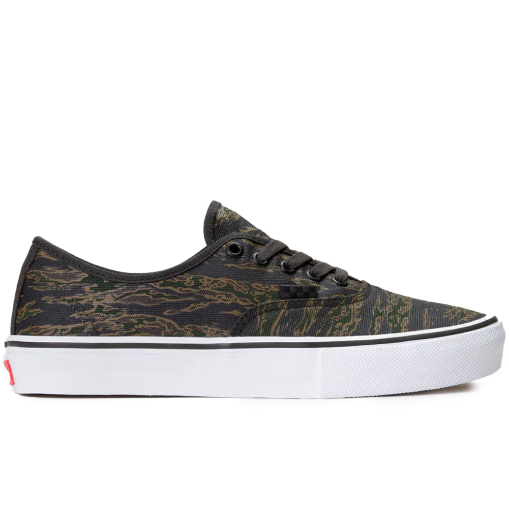 Black and white sneaker with a camo pattern on a white background