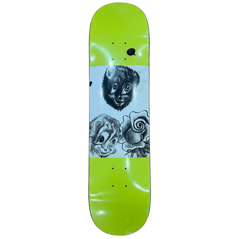 A skateboard deck with a bright neon yellow-green top and white graphic print featuring black hand-drawn faces and a rose, photographed on a wooden floor.