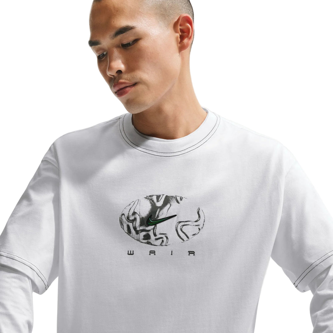 Man wearing a white long-sleeve shirt with a logo and text on a light gray background