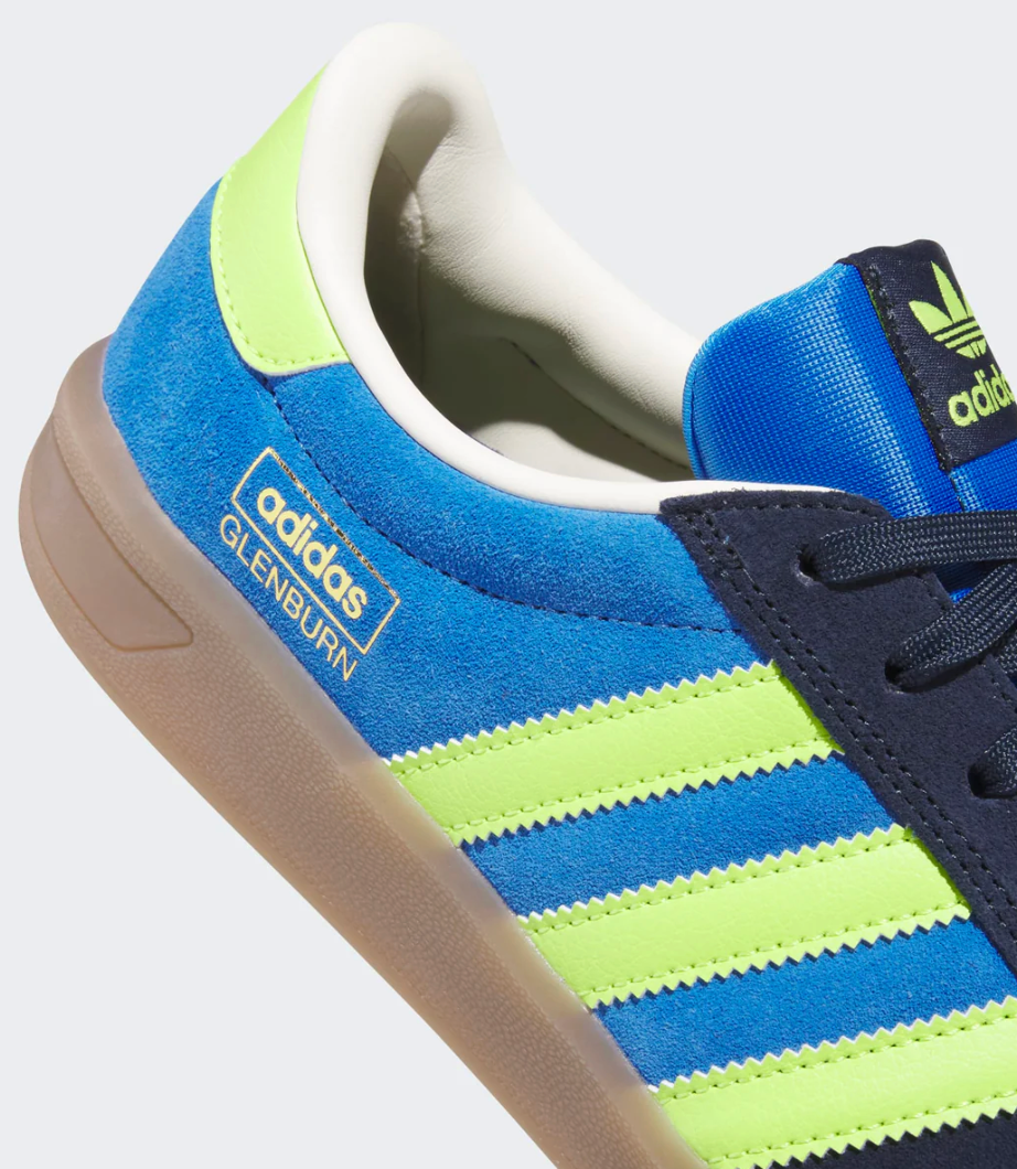 Blue and green Adidas sneaker with gold adidas glenburn logo