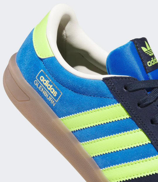 Blue and green Adidas sneaker with gold adidas glenburn logo