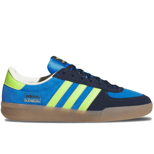 Blue and navy Adidas sneaker with green stripes on a gum sole