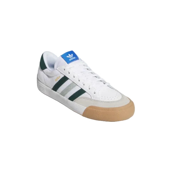White Adidas sneaker with green stripes and brown sole 