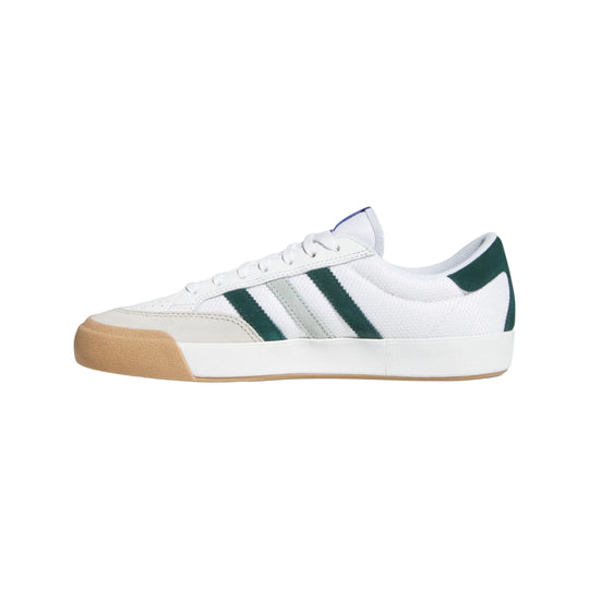 White sneaker with green stripes 
