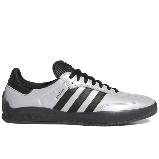 silver and black Adidas sneaker with three stripes