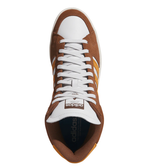 Brown and white Adidas sneaker on a white background