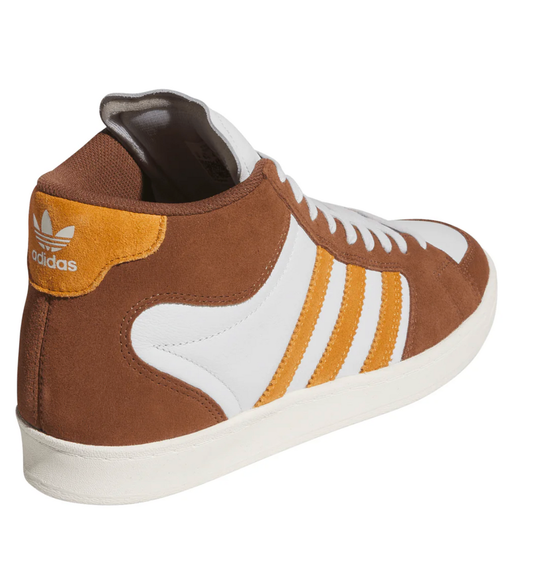 Brown and white Adidas sneaker on a white background