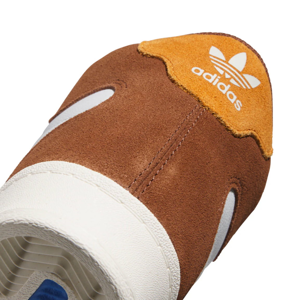 Brown Adidas sneaker with white sole on a white background