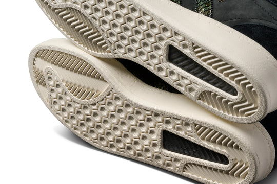 Close-up of textured beige shoe soles on a white background