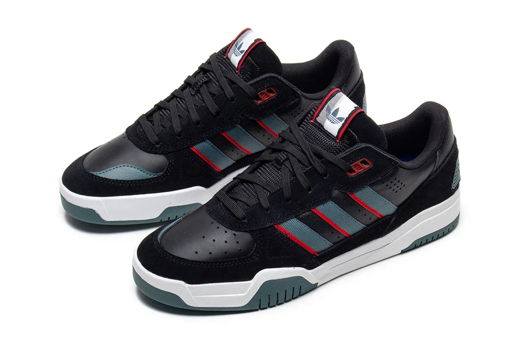 Black Adidas sneakers with red and gray accents on a white background