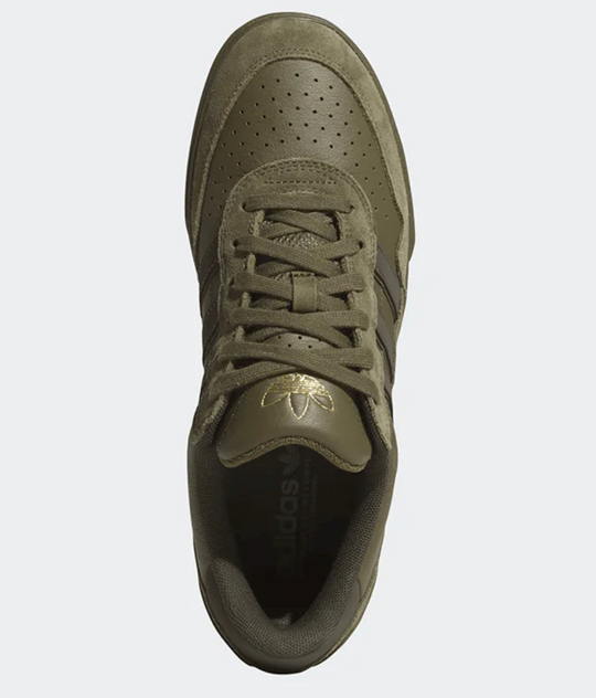 Green Adidas sneaker on a white background