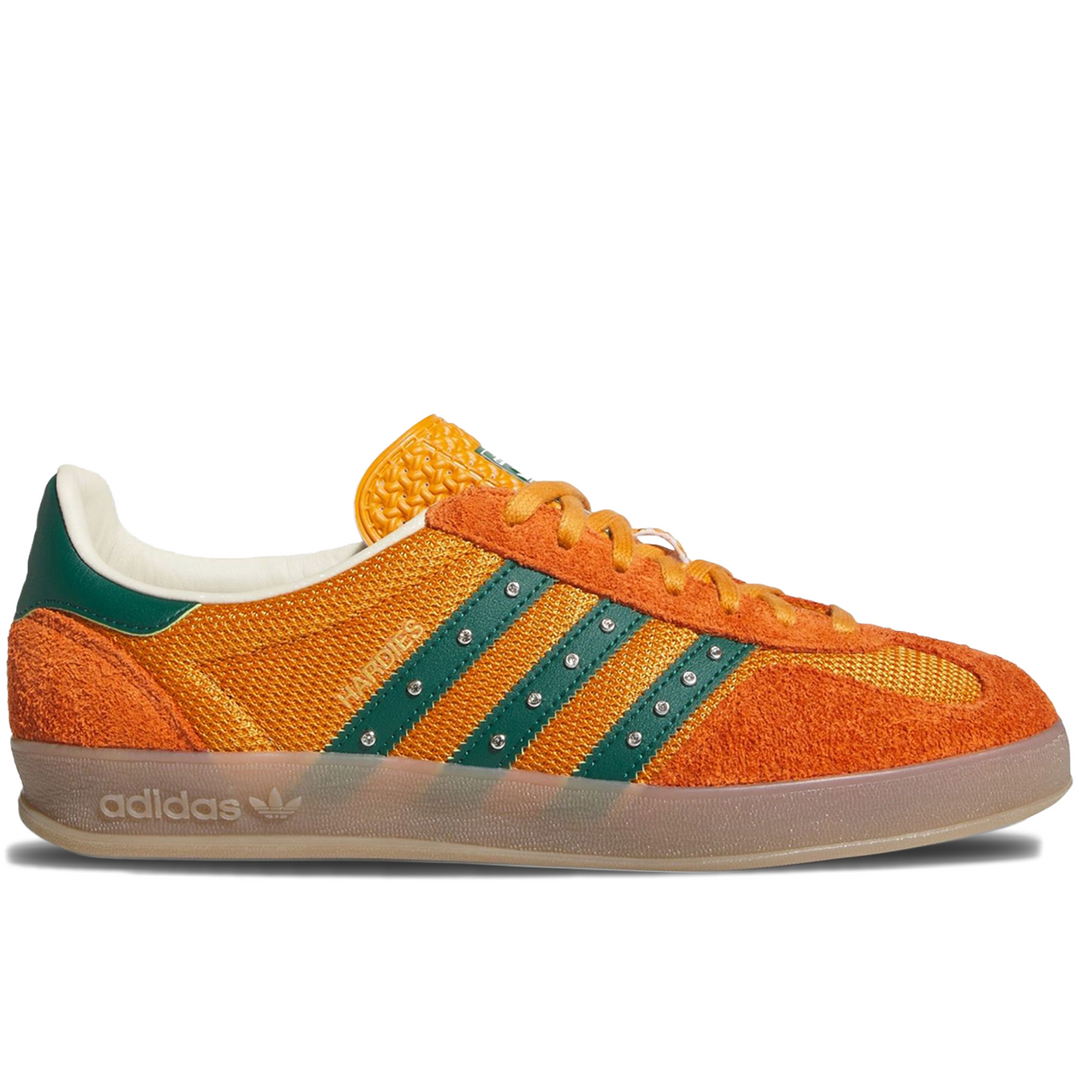 Orange Adidas sneaker with green stripes 