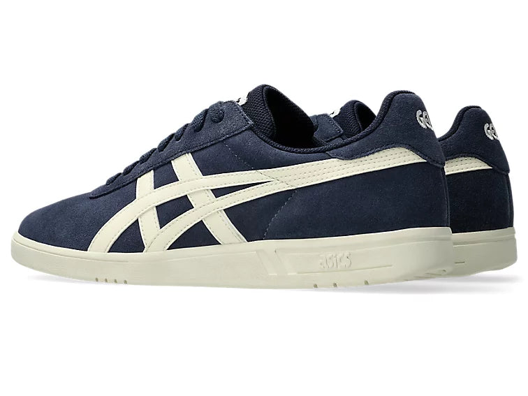 Navy blue sneaker with white accents on a white background