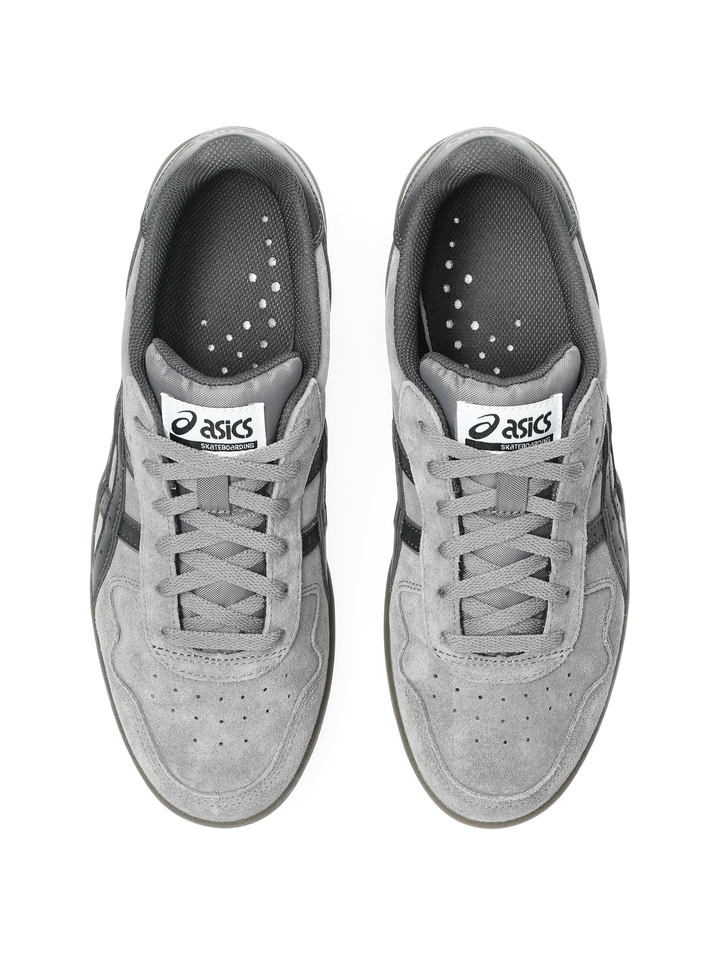 Pair of gray Asics sneakers on a white background