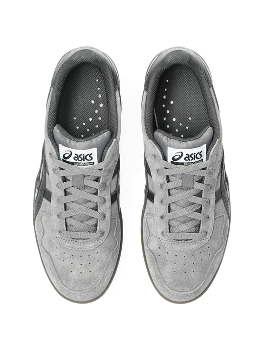 Pair of gray Asics sneakers on a white background