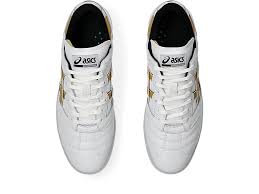 White sneakers with black soles on a white background