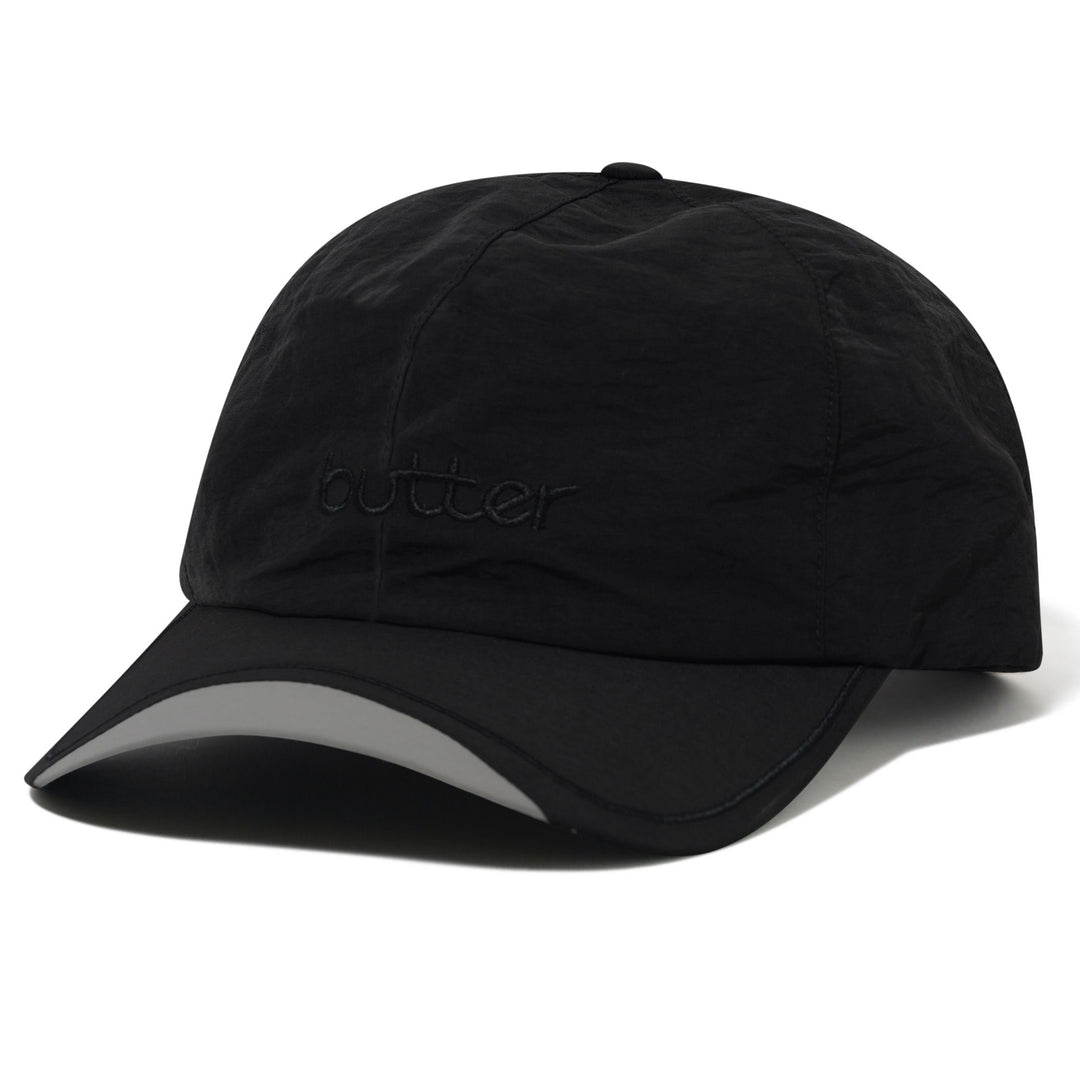 Black cap with a reflective strip on a white background