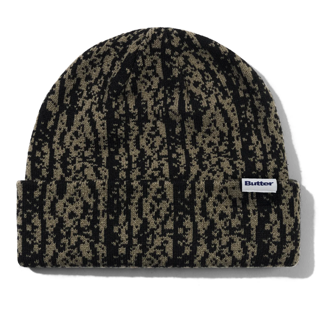 Patterned butter beanie with a brand logo 