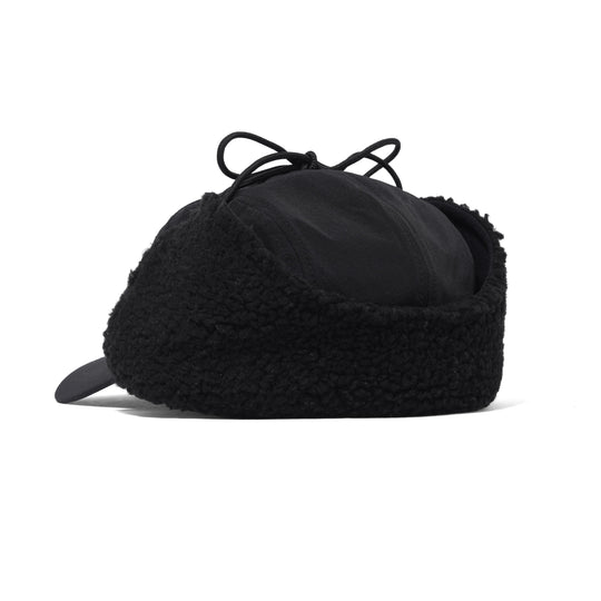 Black ear flap hat on a white background