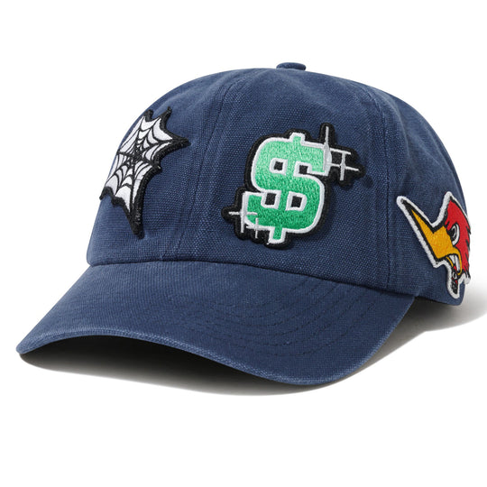 Blue cap with various Cash Only patches including a dollar sign, star, and others 