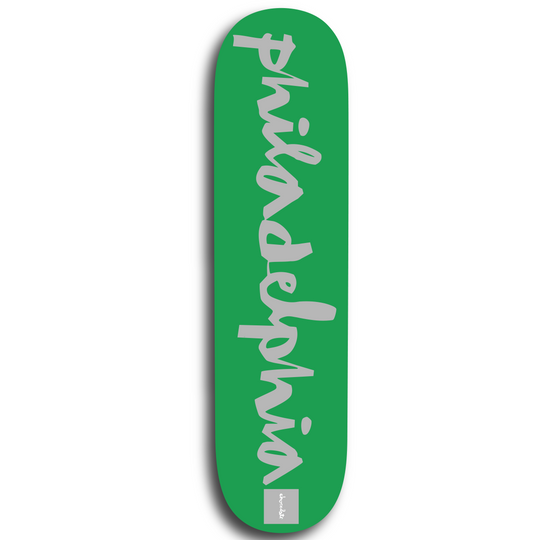 A green skateboard deck with the word &