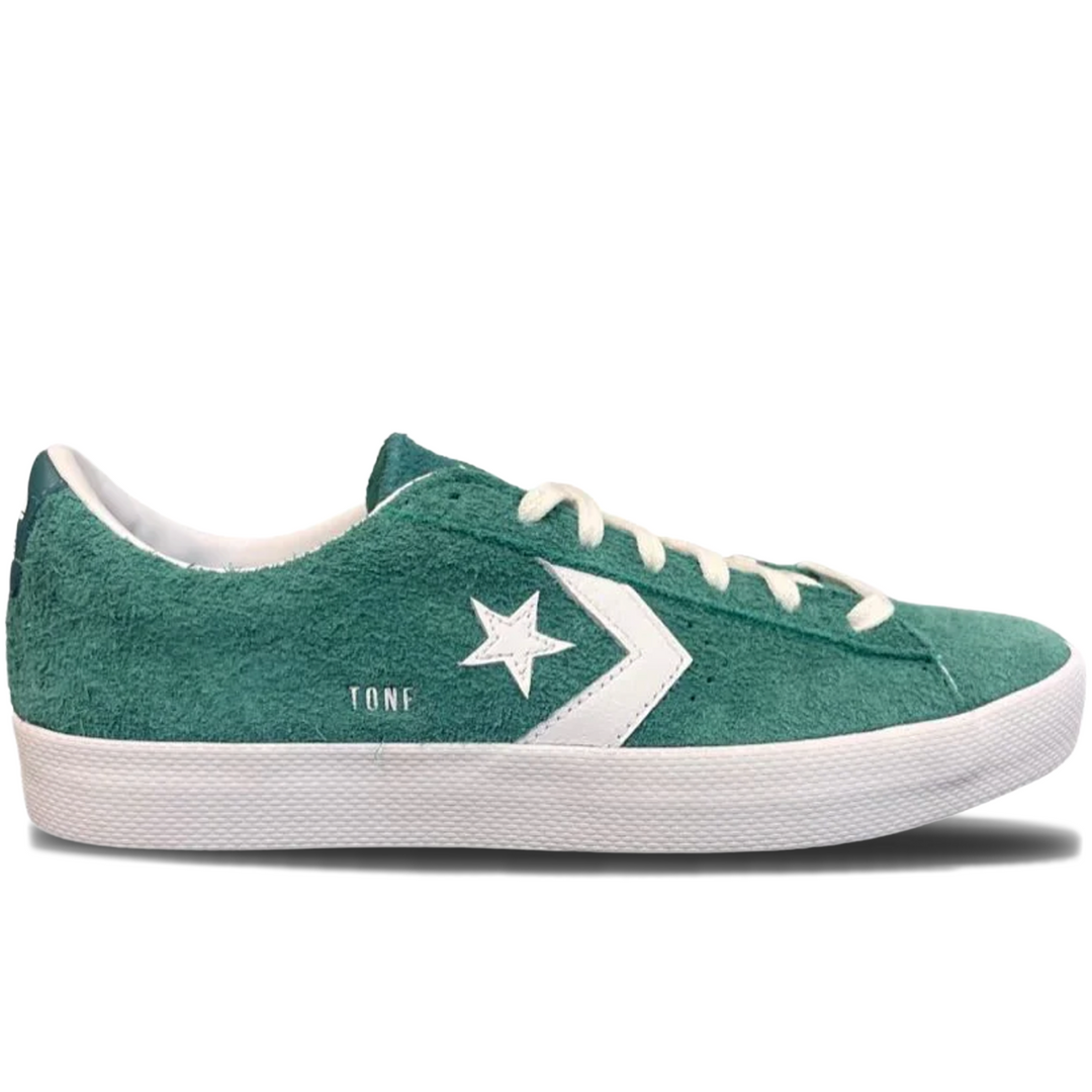 Green converse sneaker with white star logo 