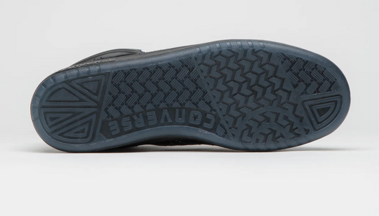 Close-up of a gray shoe sole with brand name on a white background