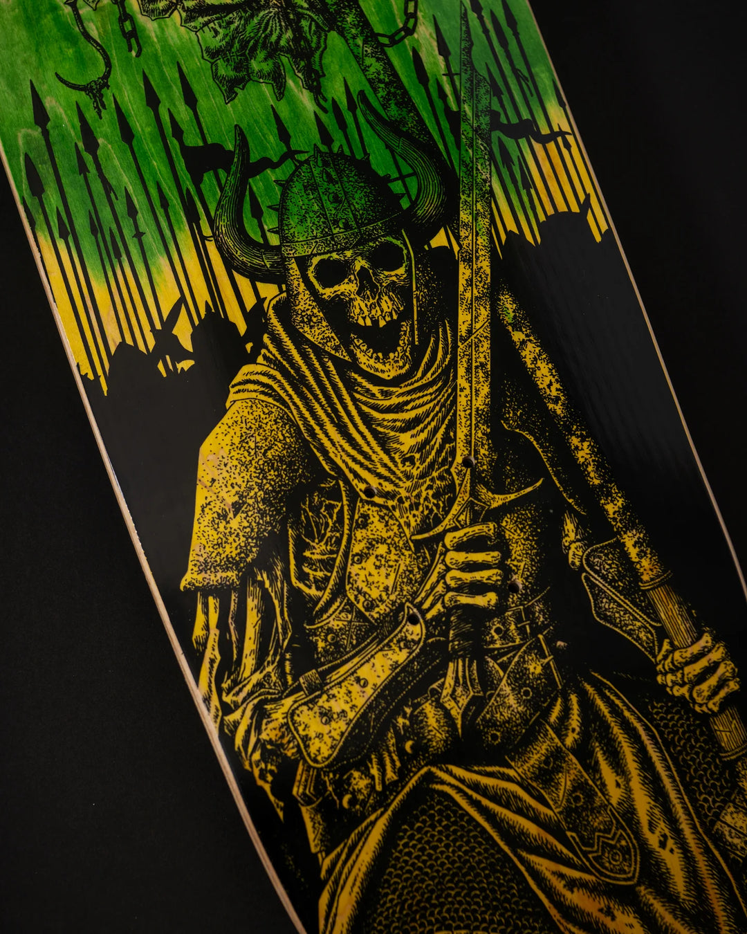 Skateboard with a skeleton cowboy design on a black background