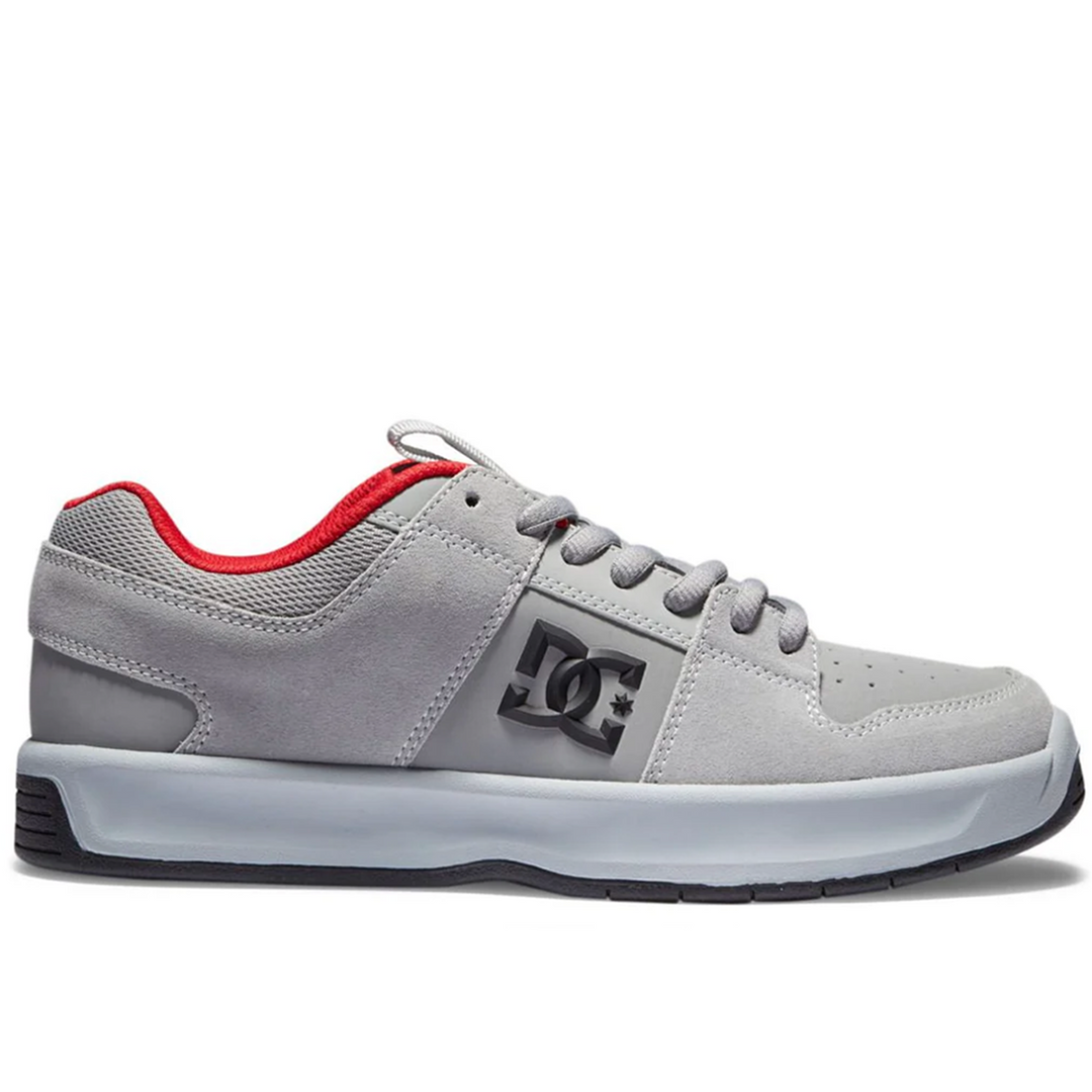 Gray sneaker with red lining on a white background