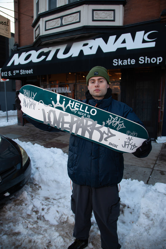 kevin bilyeu in front of skate shop  &
