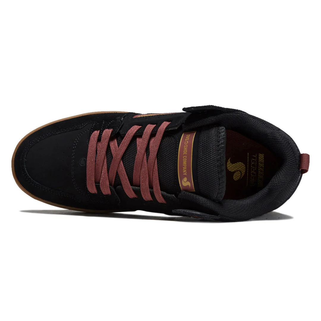 A black skate shoe with dusty rose laces, a brown gum sole, and gold branding on the side and tongue, shown from a top-down angle on a white background.