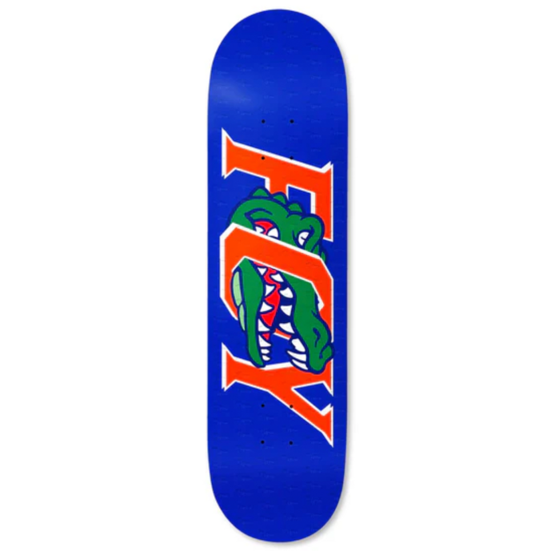 Skateboard deck with a blue background and a green alligator logo on a white background
