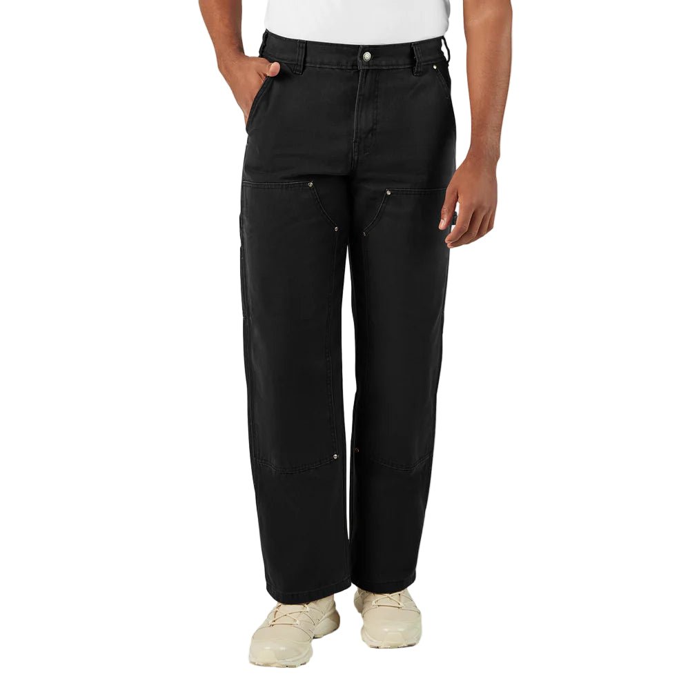Person wearing black pants on a white background