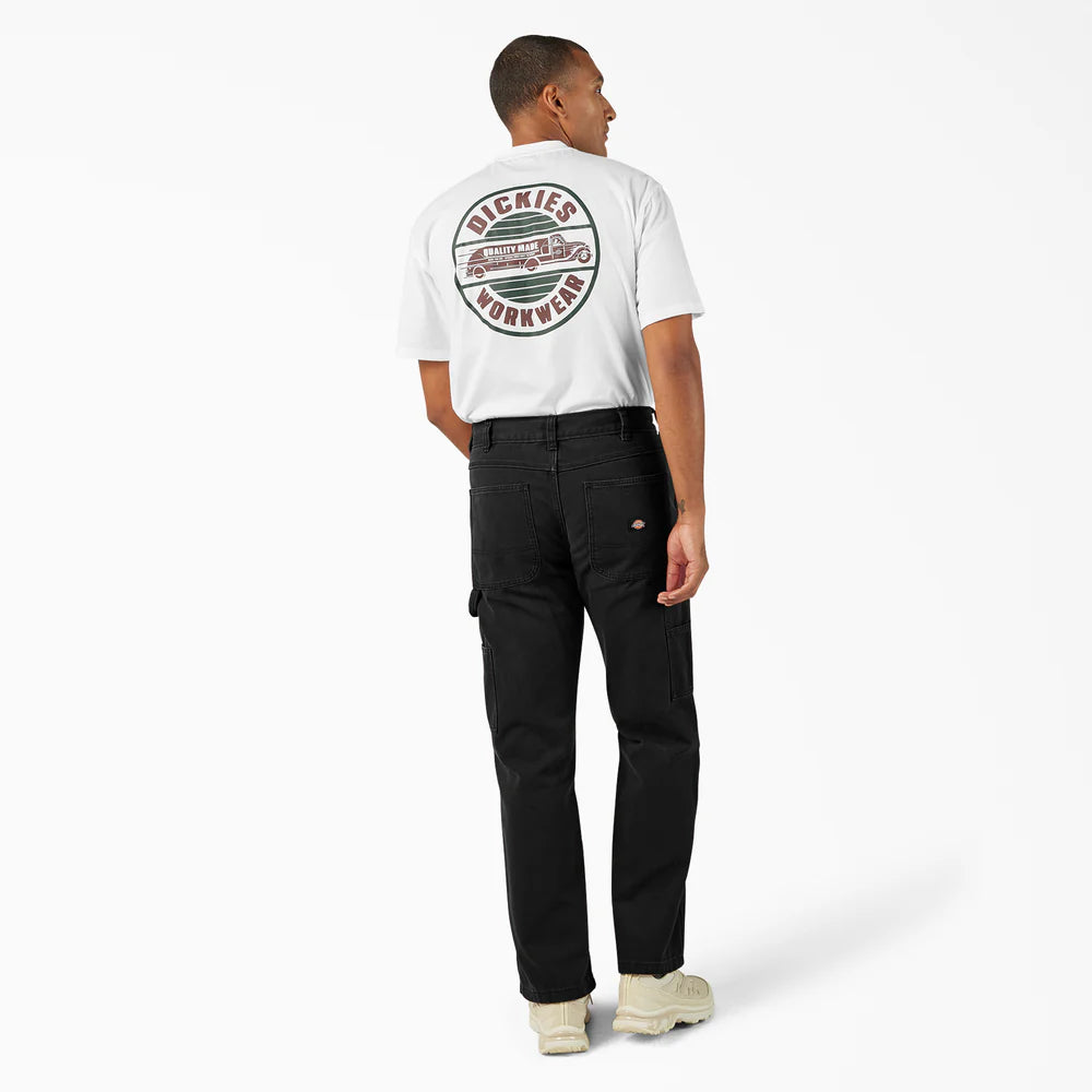 Person wearing a white t-shirt with a logo and black pants on a white background