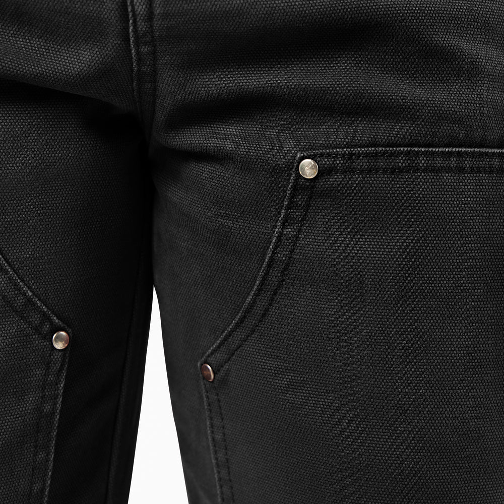 Close-up of double knee black pants with buttons
