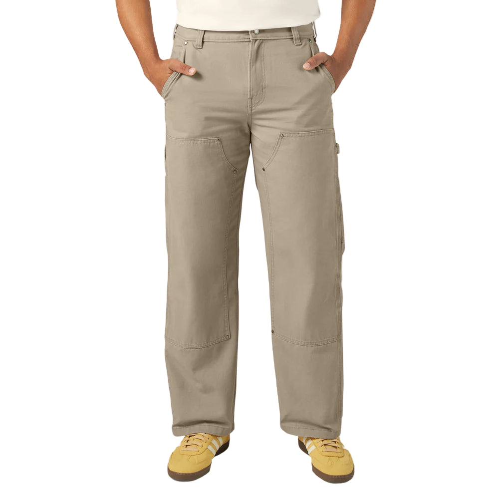 Person wearing beige pants on a white background