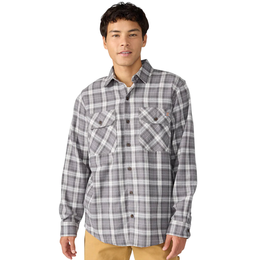 Man wearing a gray plaid shirt on a white background