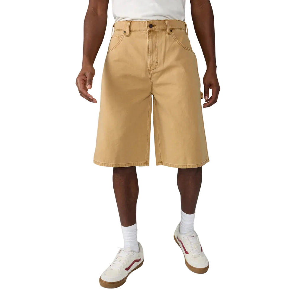 Person wearing beige shorts on a white background