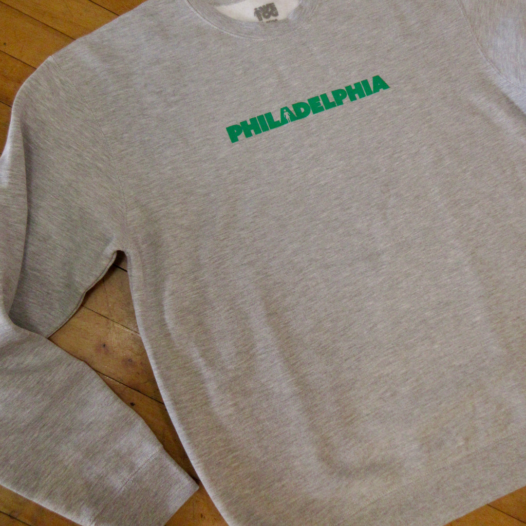 A heather gray crewneck sweatshirt with &