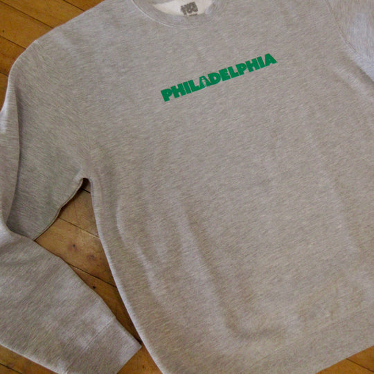 A heather gray crewneck sweatshirt with &