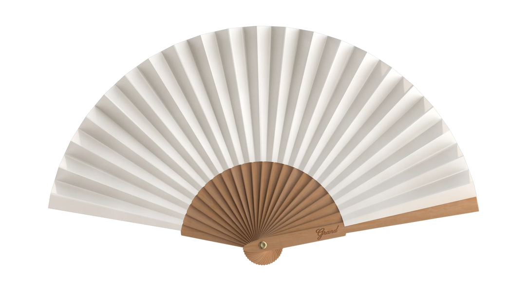 White folding fan with wooden handle on a white background