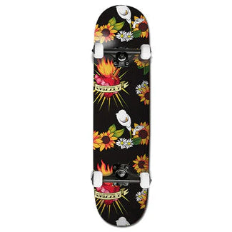 Skateboard deck with colorful floral design on a black background