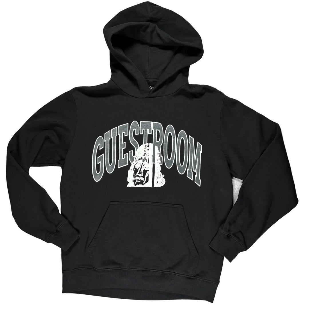 A black pullover hoodie with a white graphic on the chest reading &