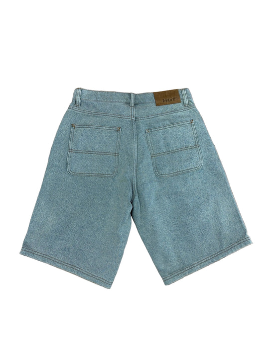 Blue denim shorts on a white background